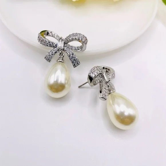 Anthro Shashi Pave Pearl Bow Earrings - Picture 4 of 6